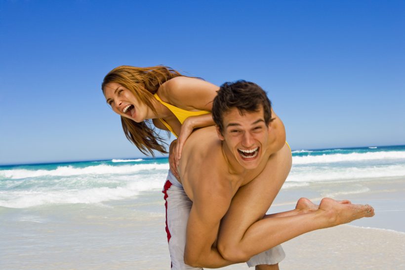 Playful couple at beach